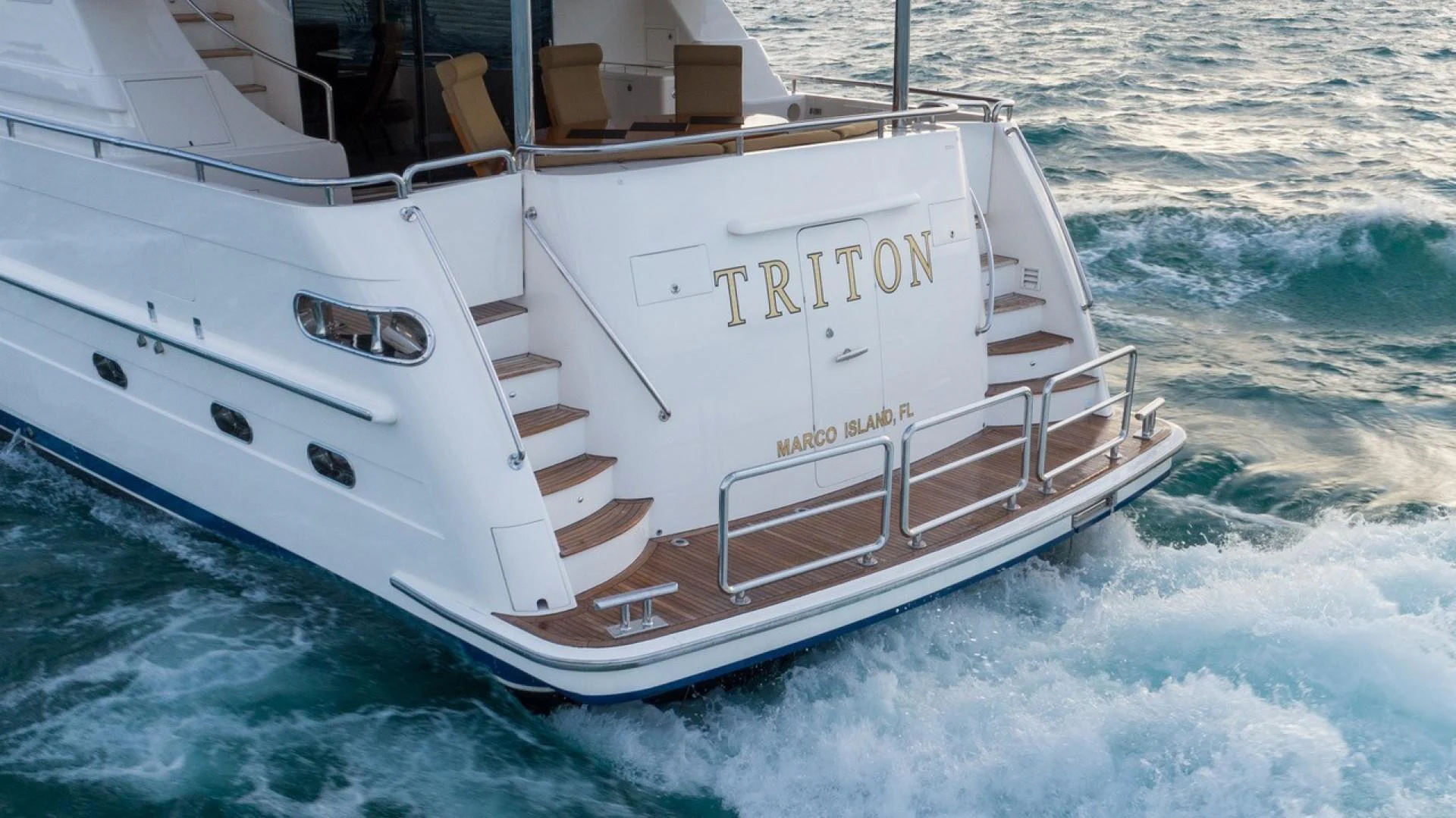 a white boat in the water aboard TRITON Yacht for Sale