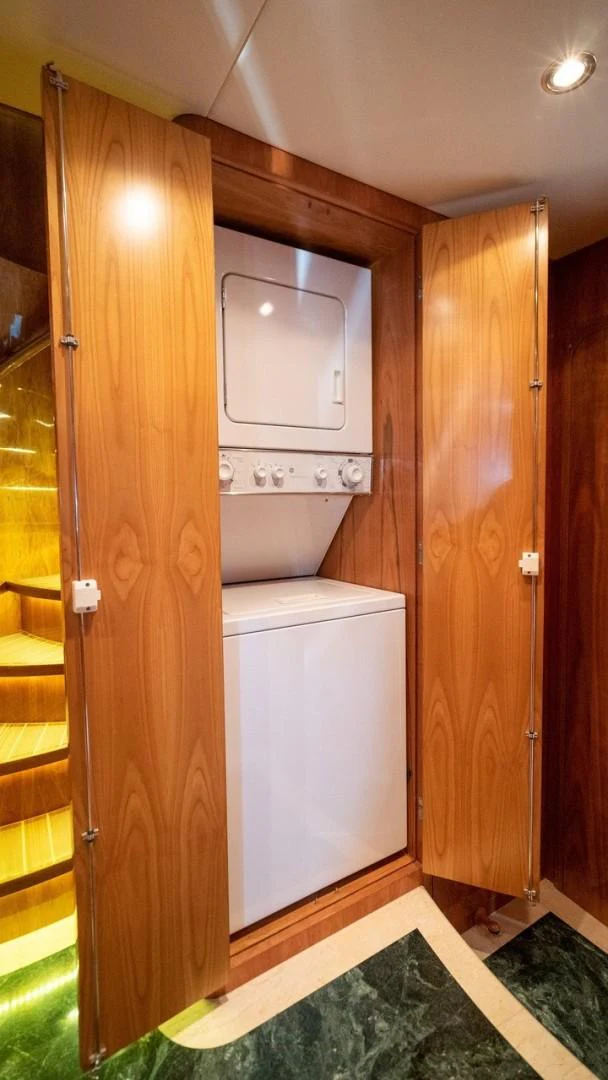 a closet with a microwave and a door aboard TRITON Yacht for Sale