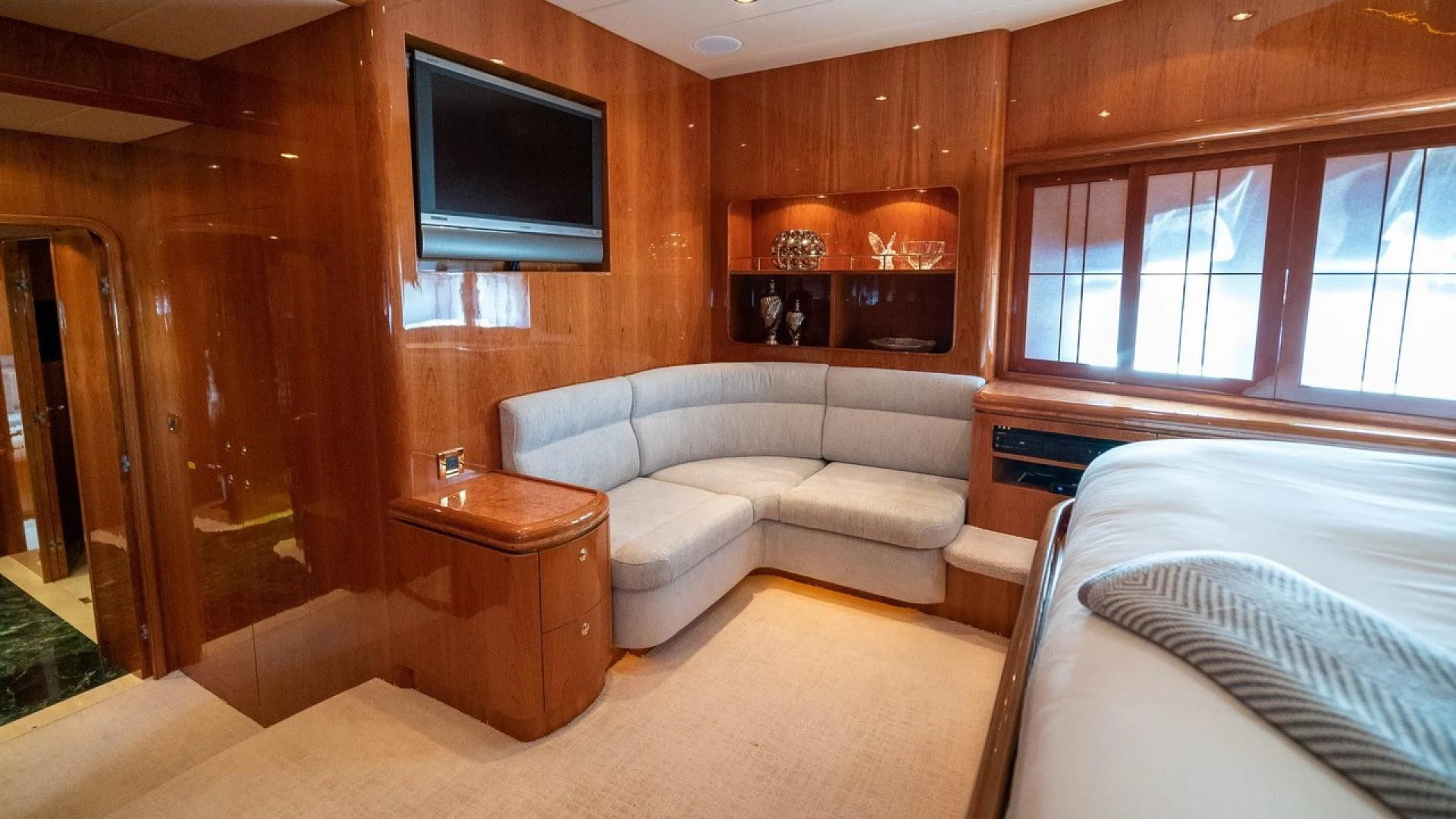 a living room with a couch and a tv aboard TRITON Yacht for Sale