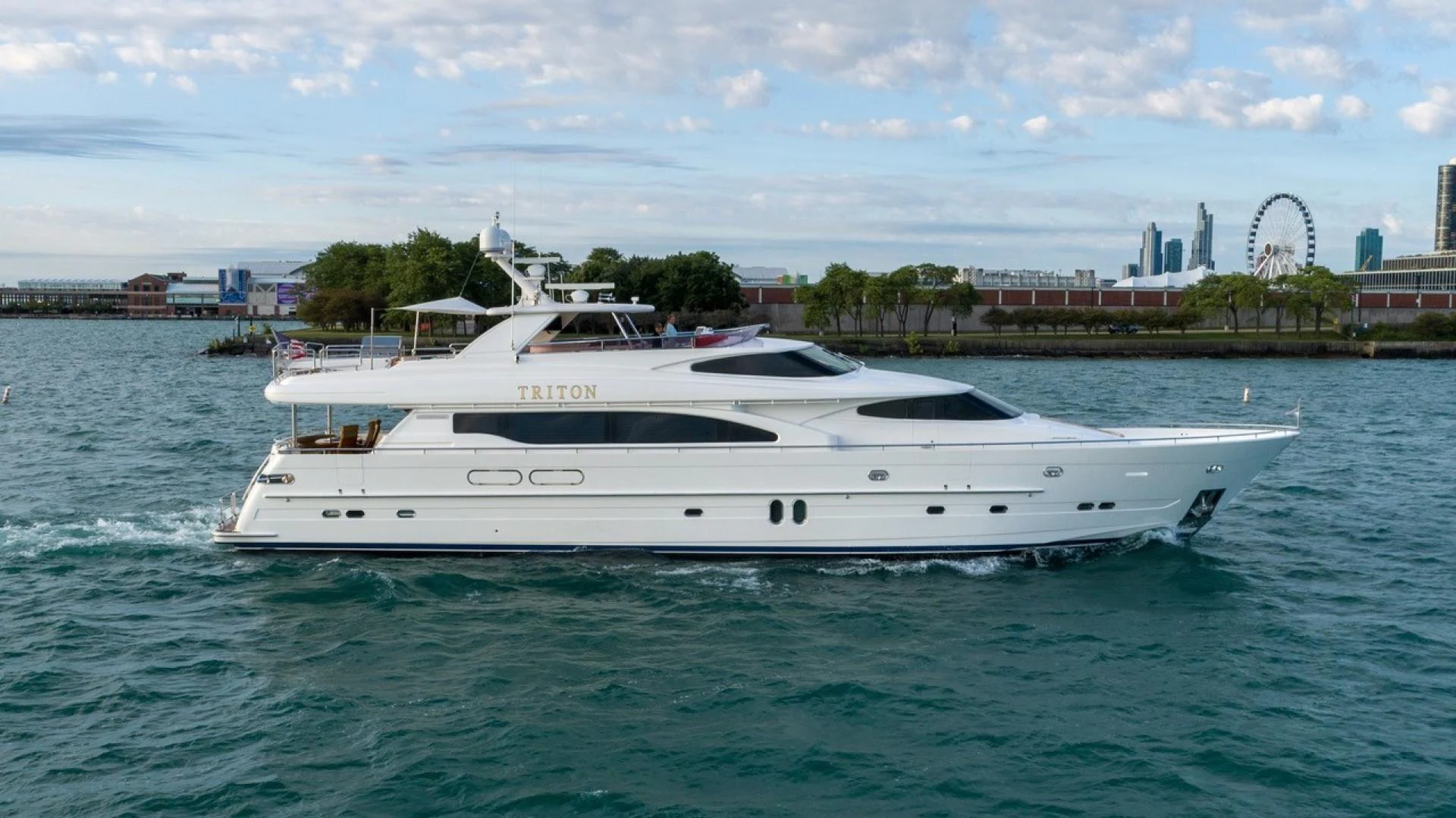 a white yacht in the water aboard TRITON Yacht for Sale