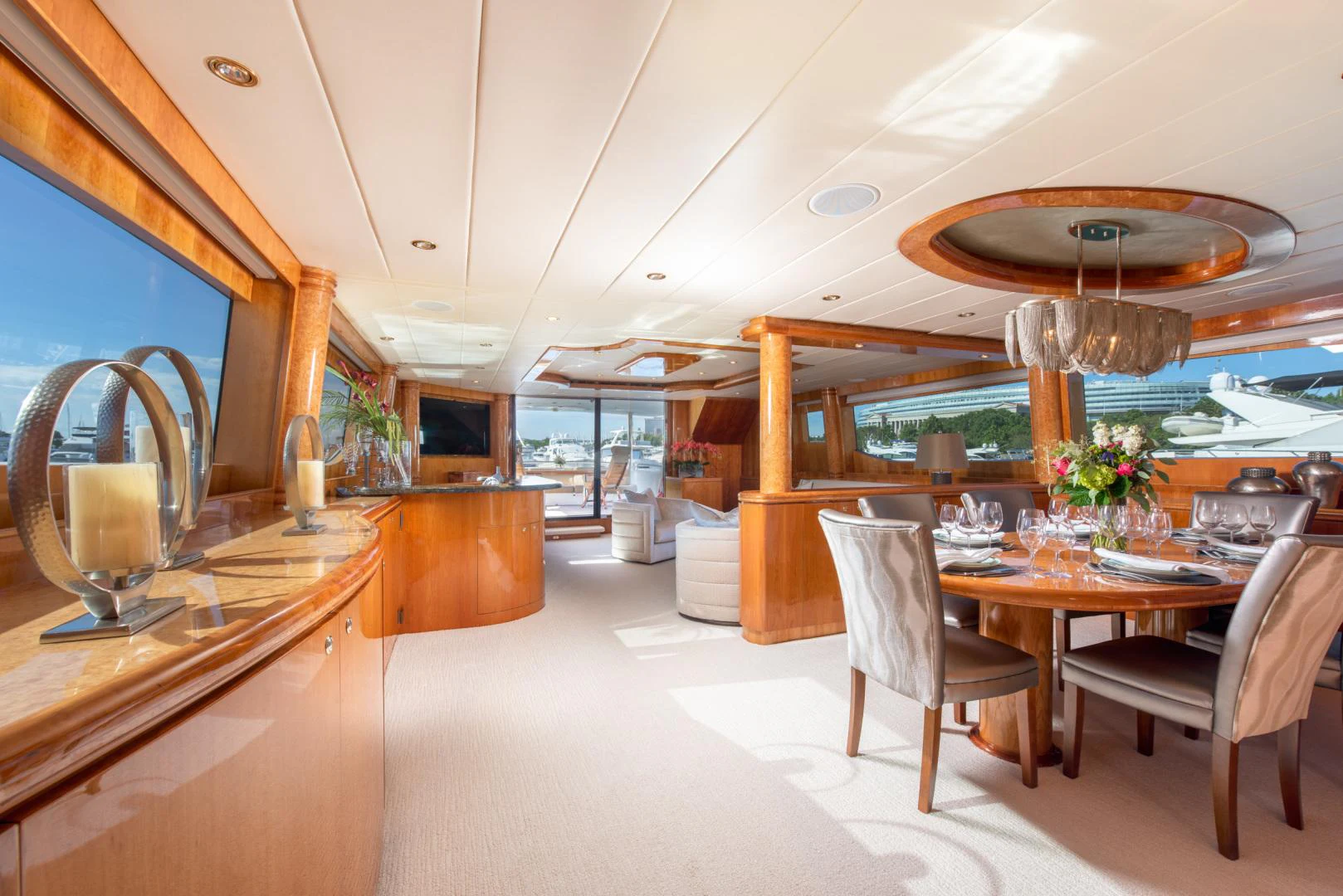 a kitchen with a table and chairs aboard TRITON Yacht for Sale