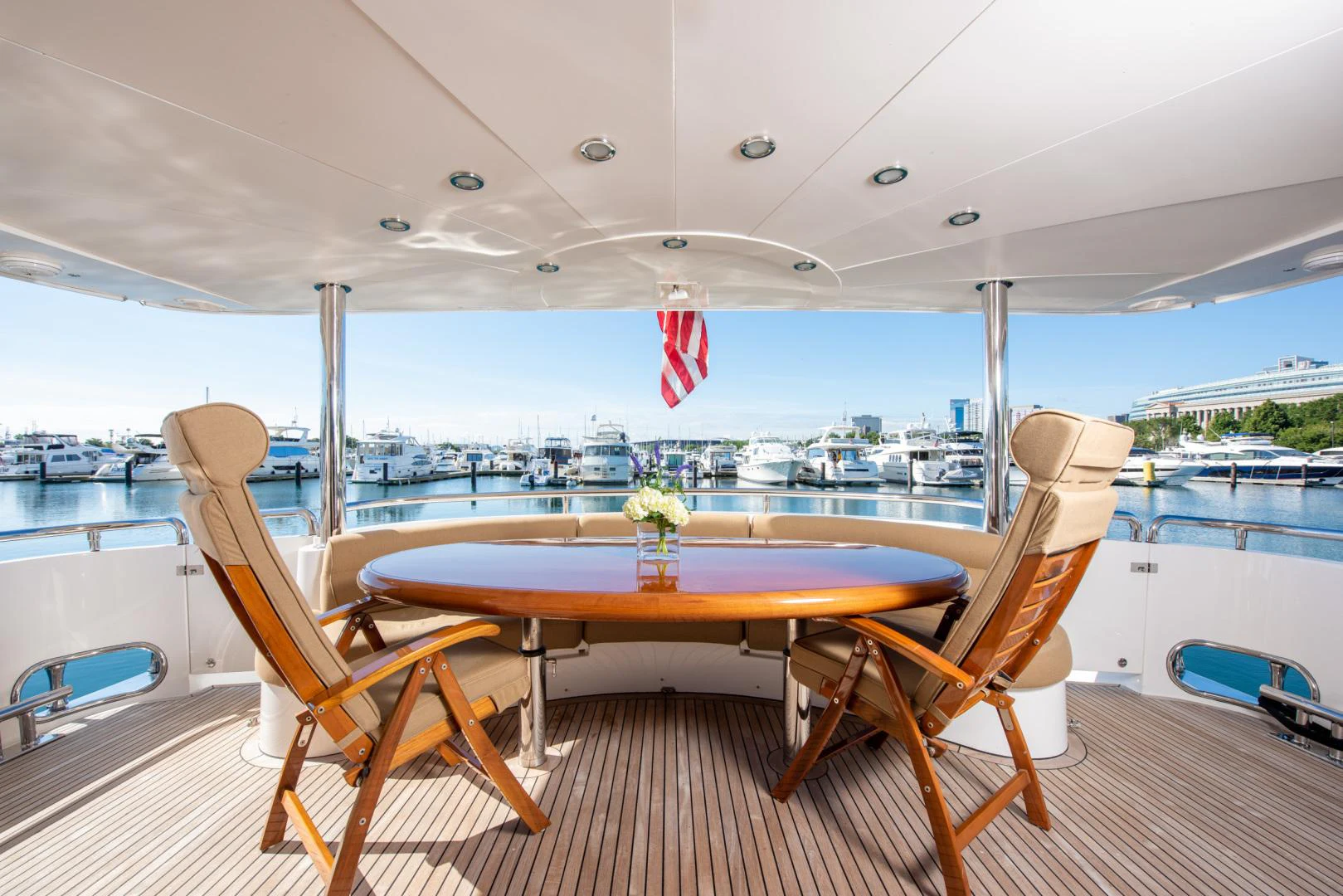 a table and chairs on a deck aboard TRITON Yacht for Sale