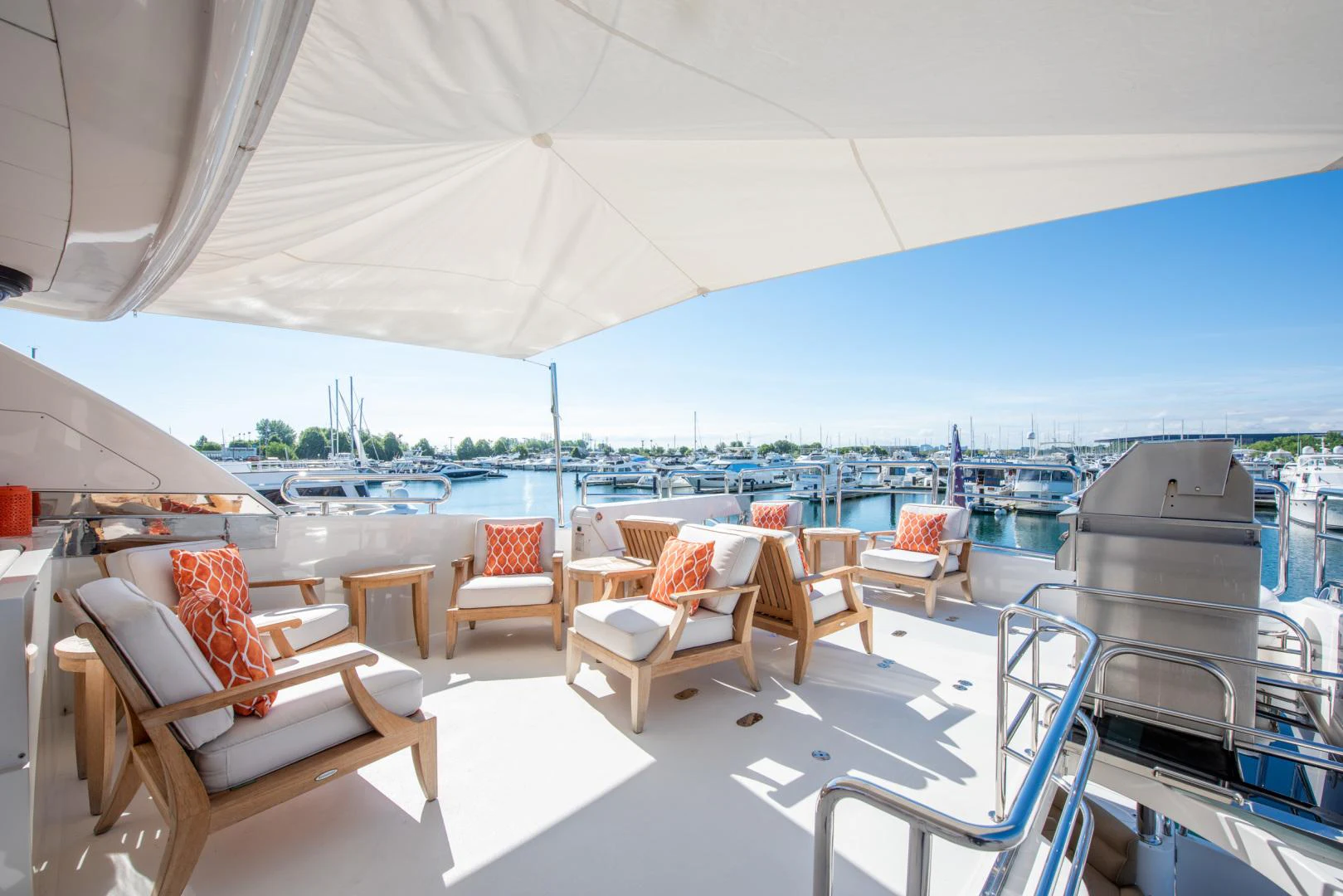 a boat with chairs and tables aboard TRITON Yacht for Sale
