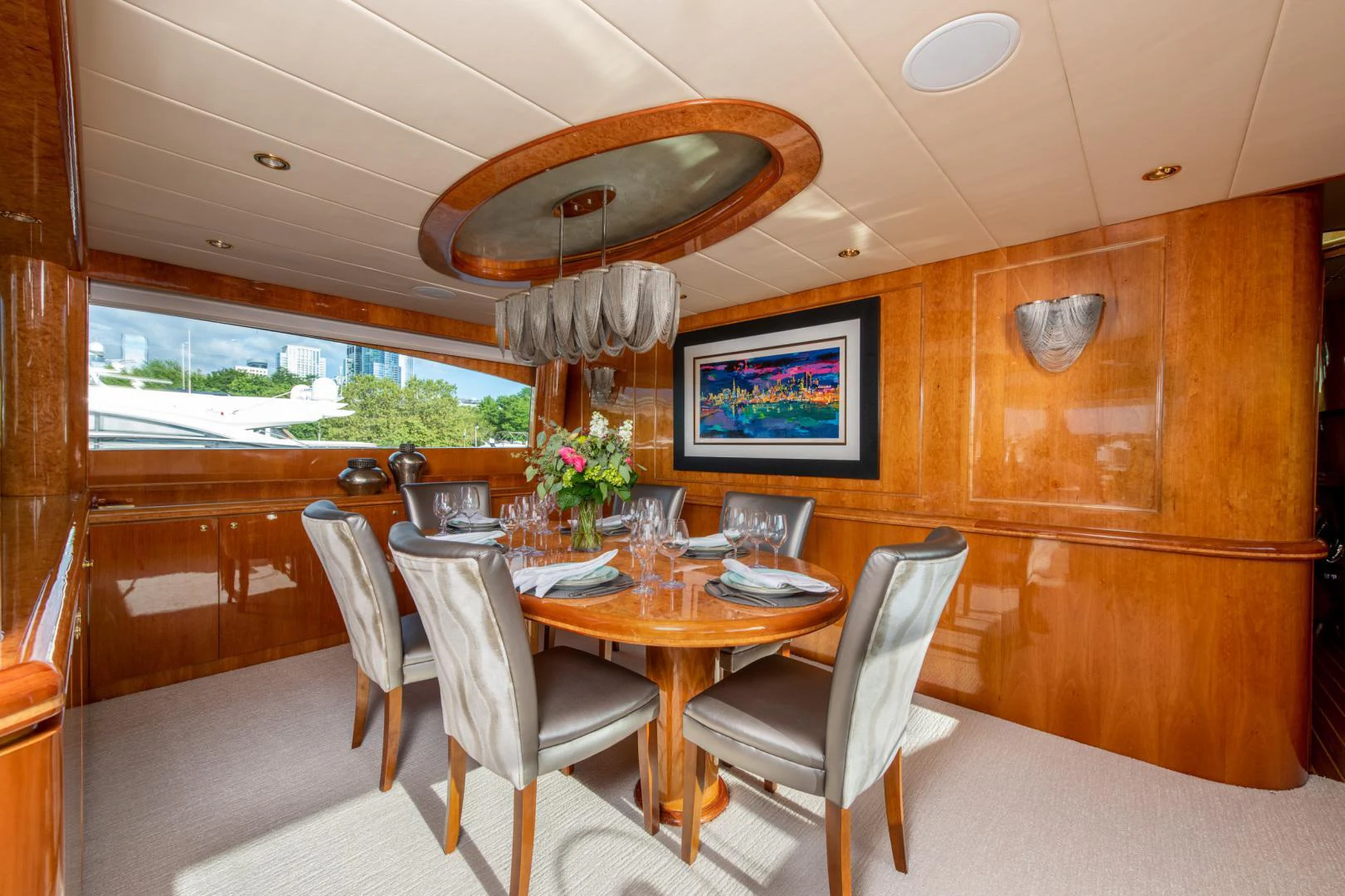 a dining room with a table and chairs aboard TRITON Yacht for Sale