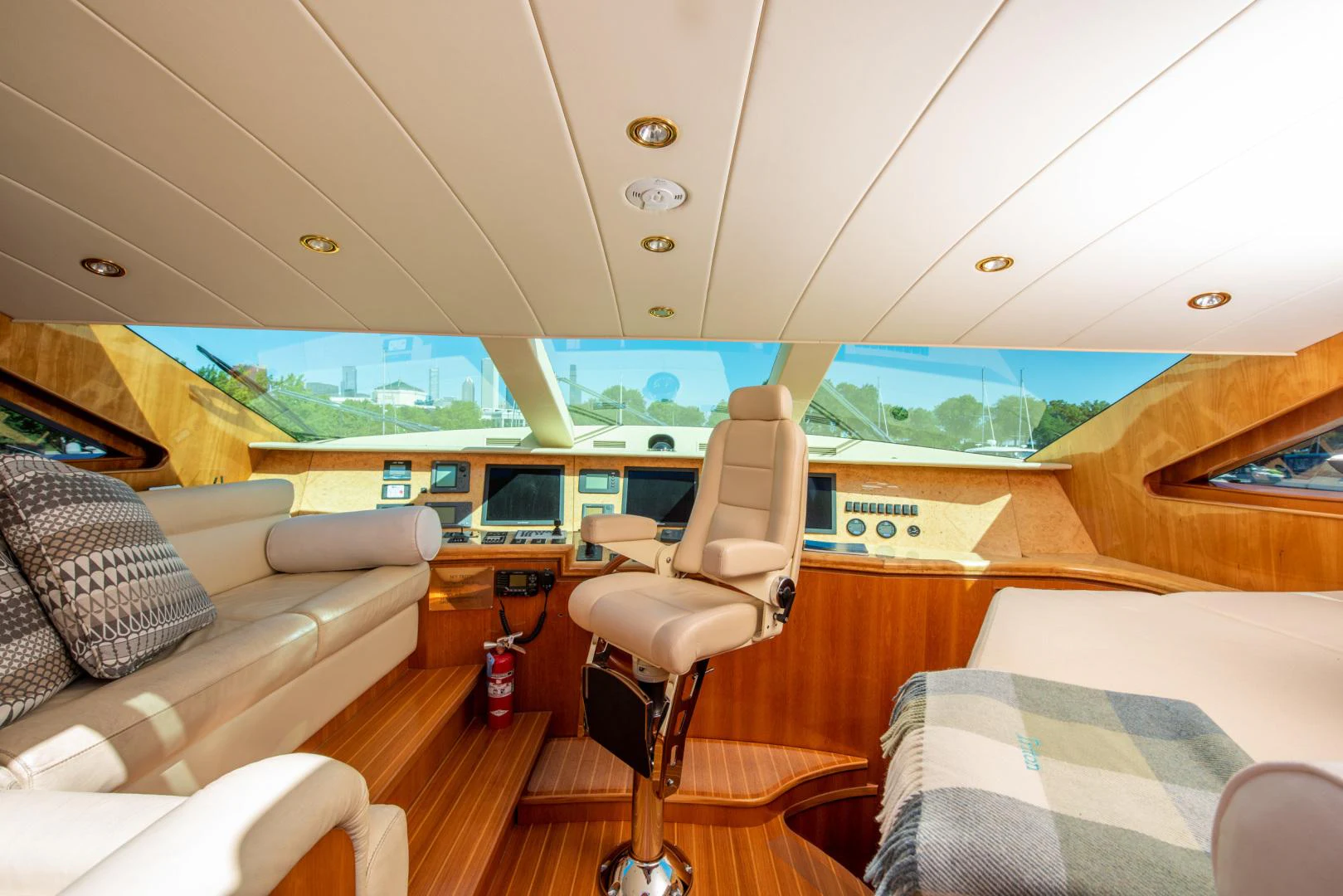 a room with a couch and a table and a chair aboard TRITON Yacht for Sale
