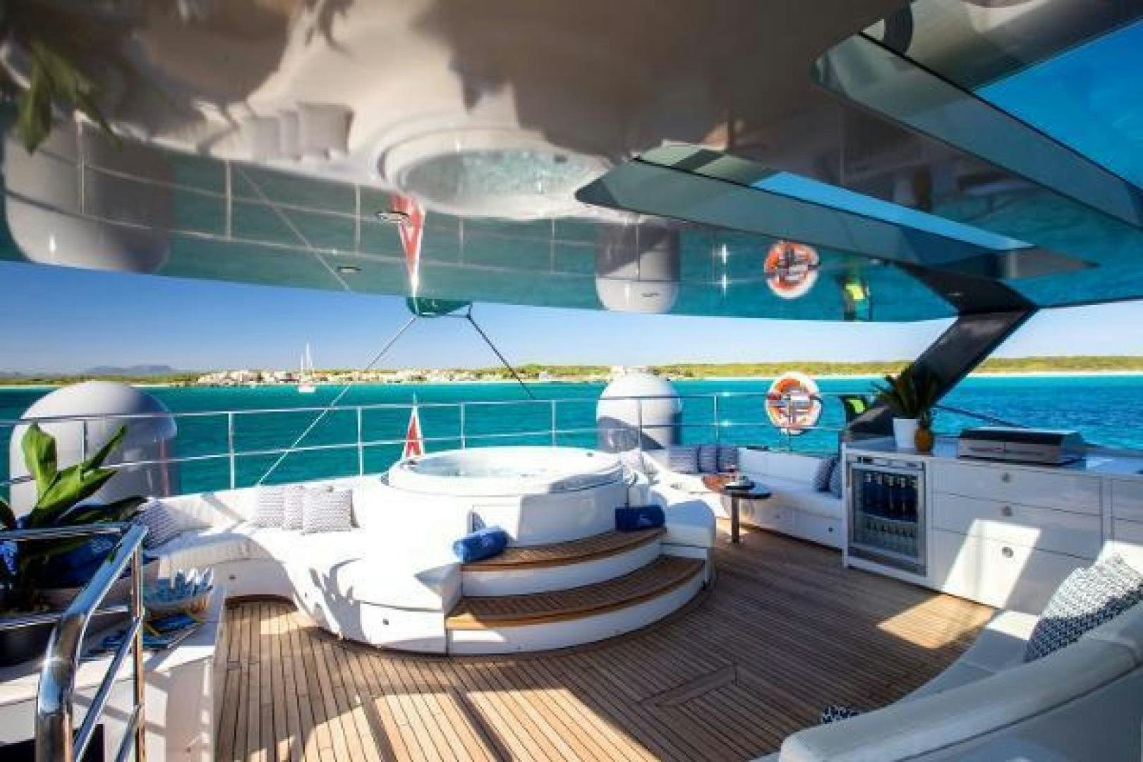 a swimming pool with a deck aboard CARTOUCHE Yacht for Sale