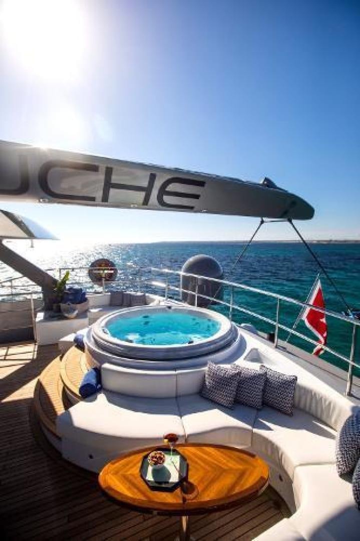 a pool with a large pool and a view of the ocean aboard CARTOUCHE Yacht for Sale