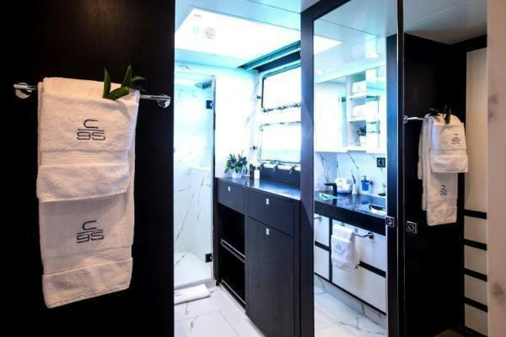 a room with a door open aboard CARTOUCHE Yacht for Sale