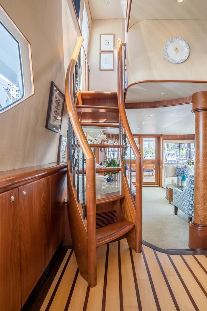a wooden staircase in a house aboard FAN TAIL Yacht for Sale