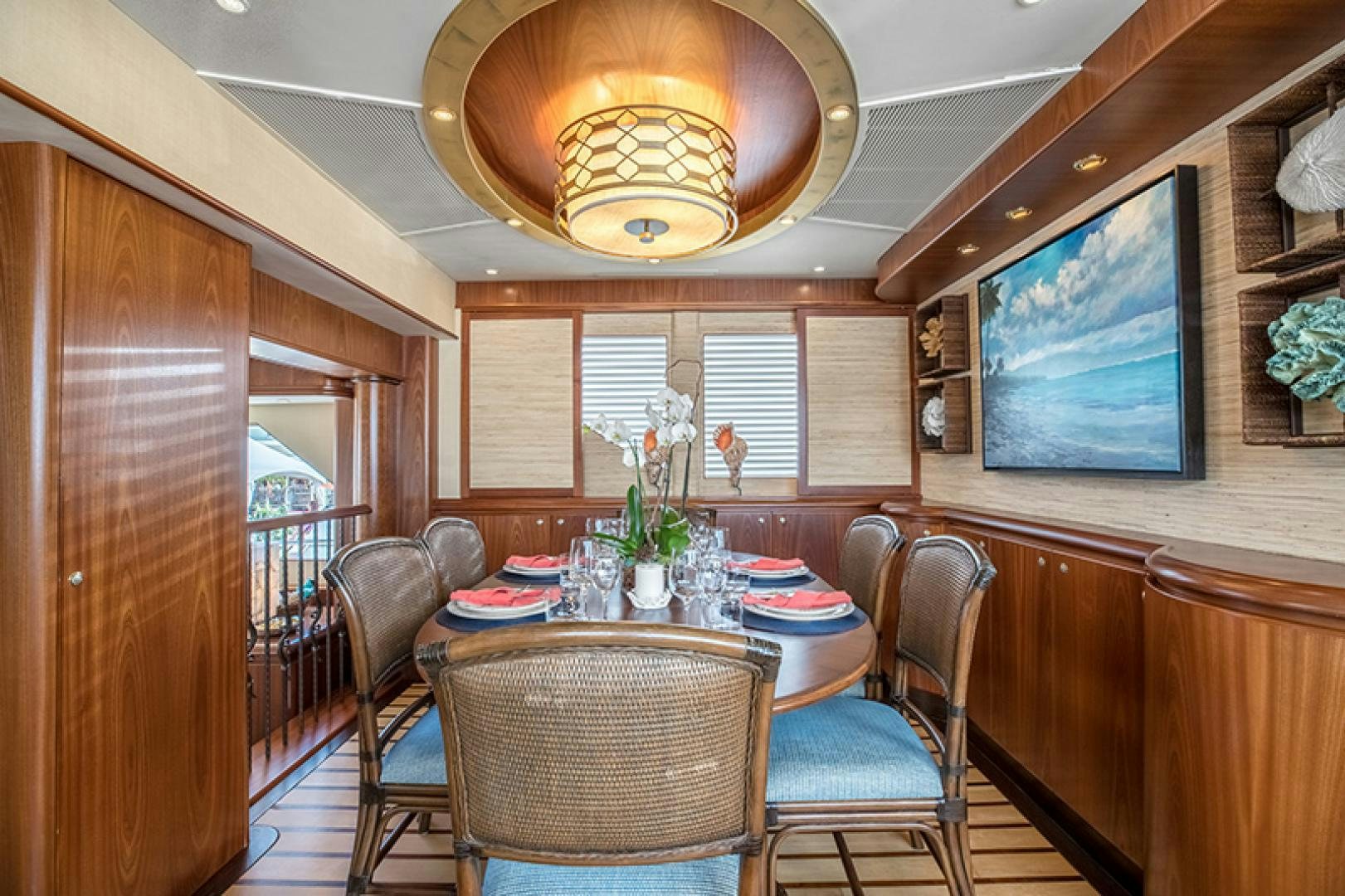 a dining room with a table and chairs aboard FAN TAIL Yacht for Sale