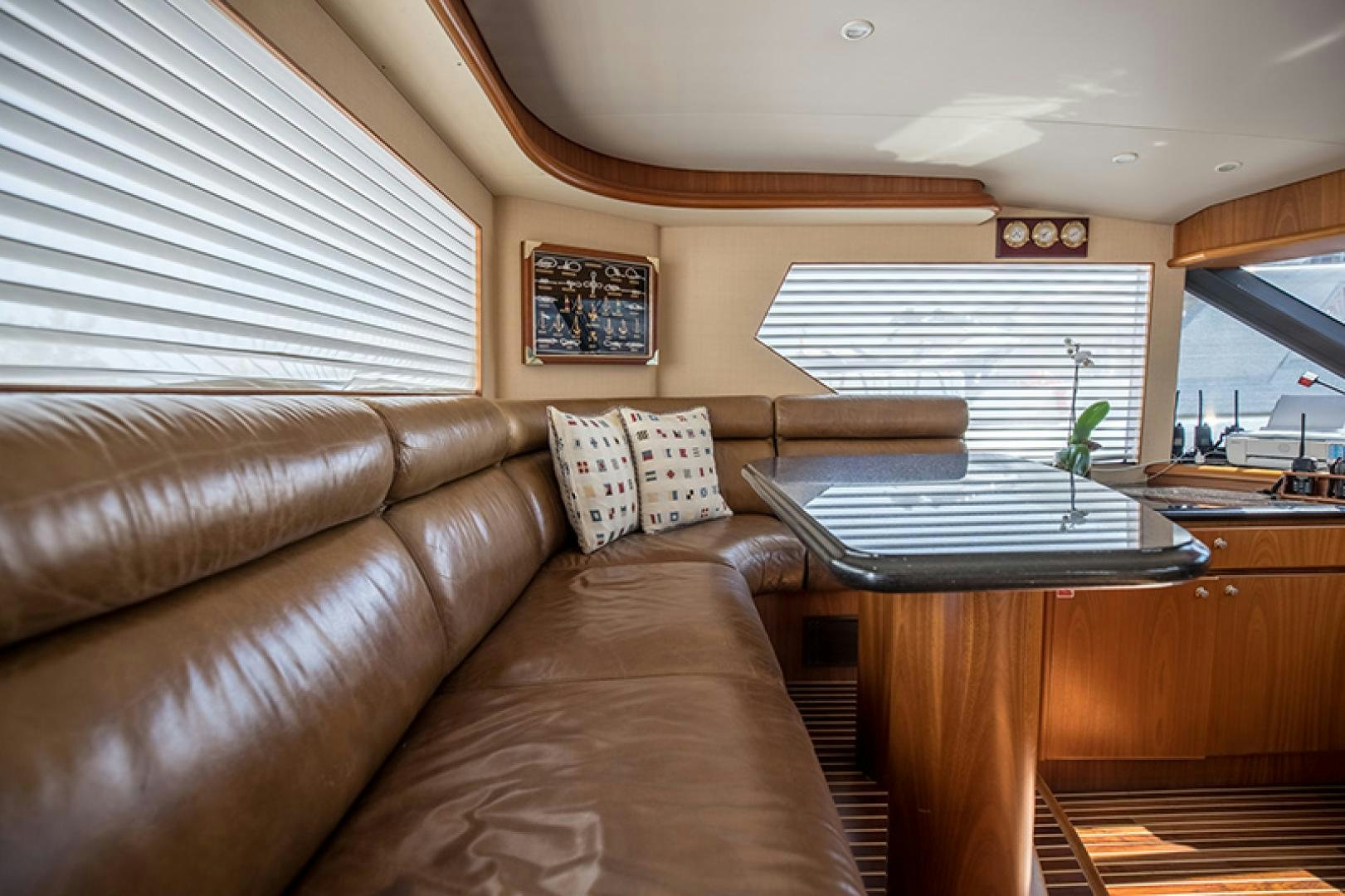 a living room with a couch and a coffee table aboard FAN TAIL Yacht for Sale