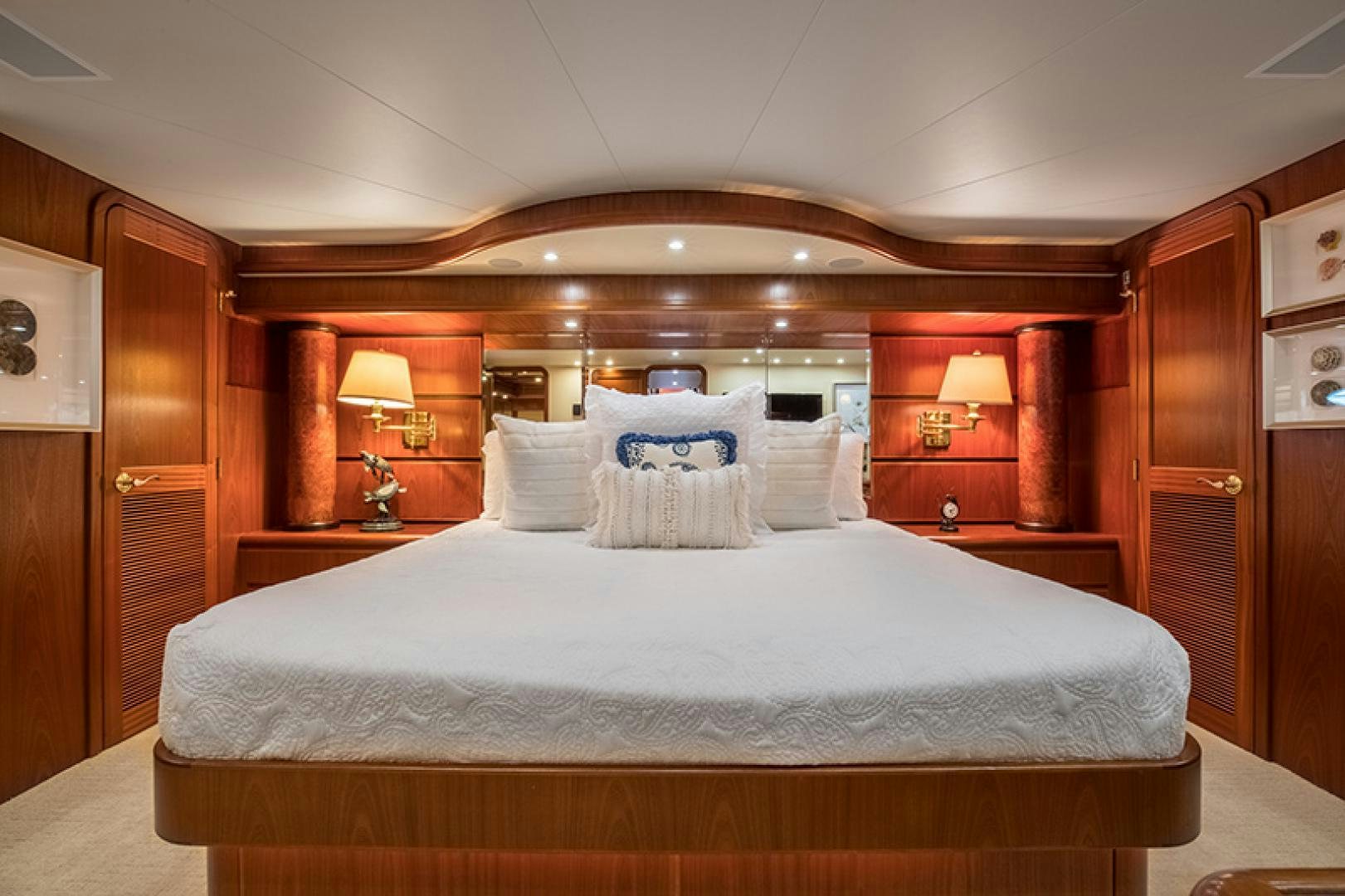 a bed with a white comforter aboard FAN TAIL Yacht for Sale