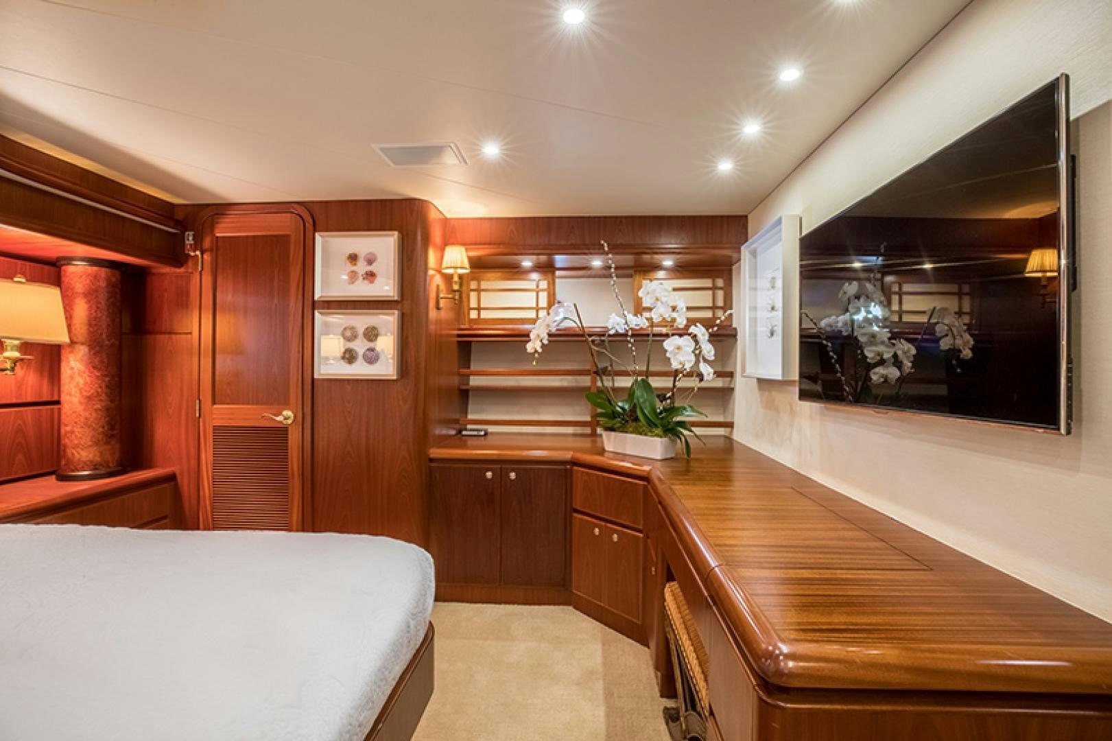 a room with a couch and a table and a mirror aboard FAN TAIL Yacht for Sale