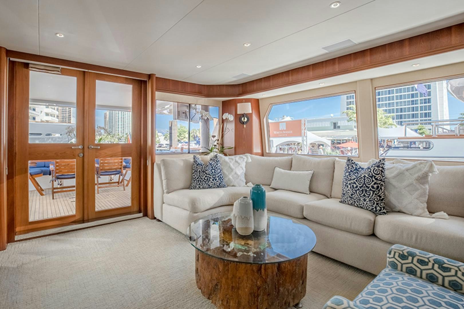 a living room with a couch and a table aboard FAN TAIL Yacht for Sale