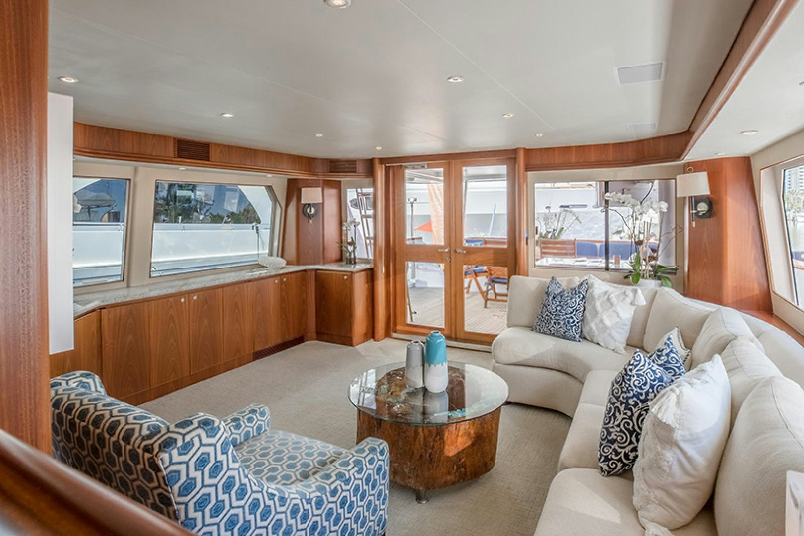 a living room with a table and couches aboard FAN TAIL Yacht for Sale