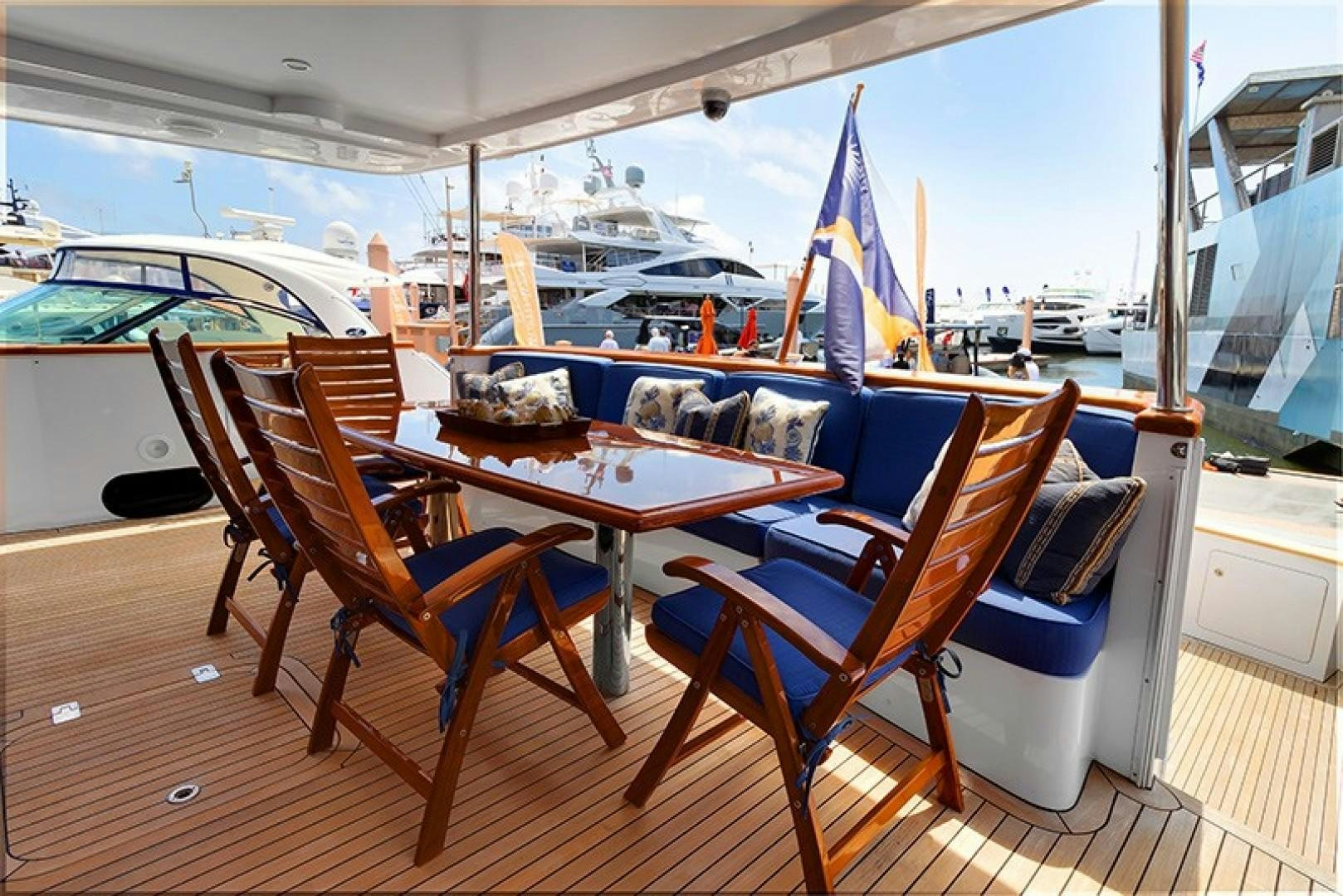 a table and chairs on a boat aboard FAN TAIL Yacht for Sale