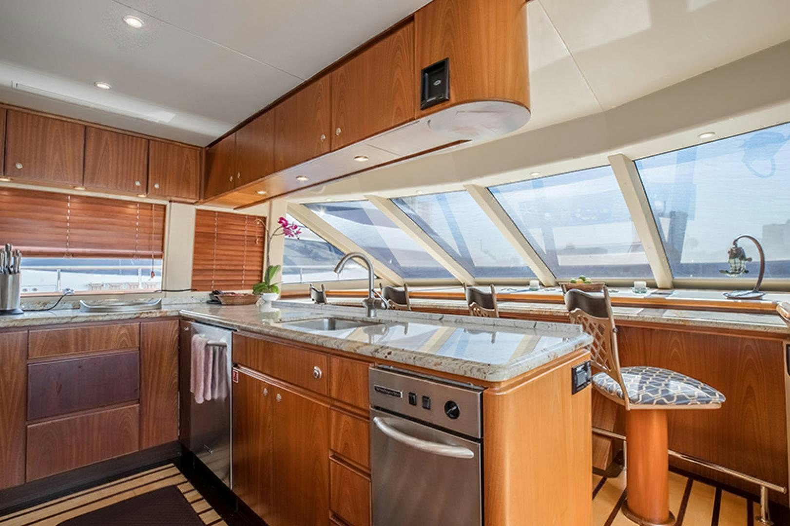 a kitchen with wooden cabinets aboard FAN TAIL Yacht for Sale