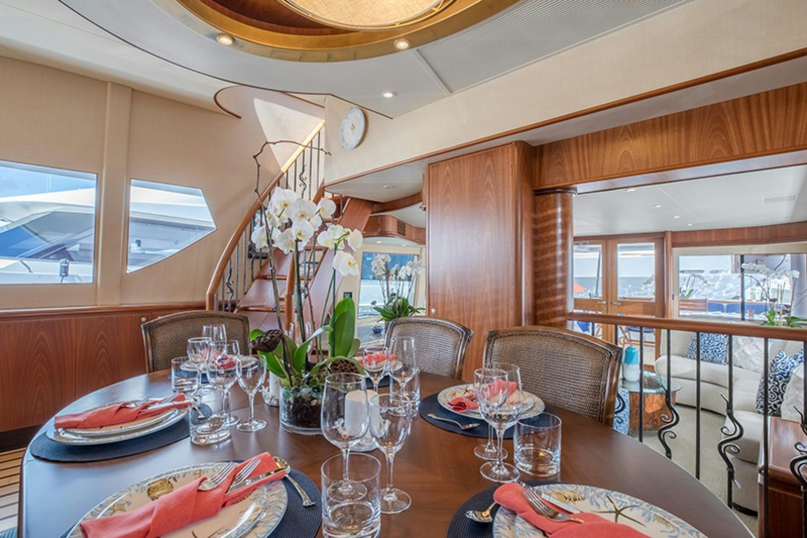 a dining table with glasses and plates aboard FAN TAIL Yacht for Sale
