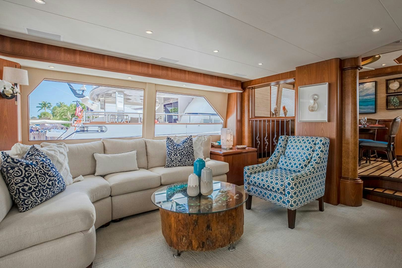 a living room with a couch and a table aboard FAN TAIL Yacht for Sale