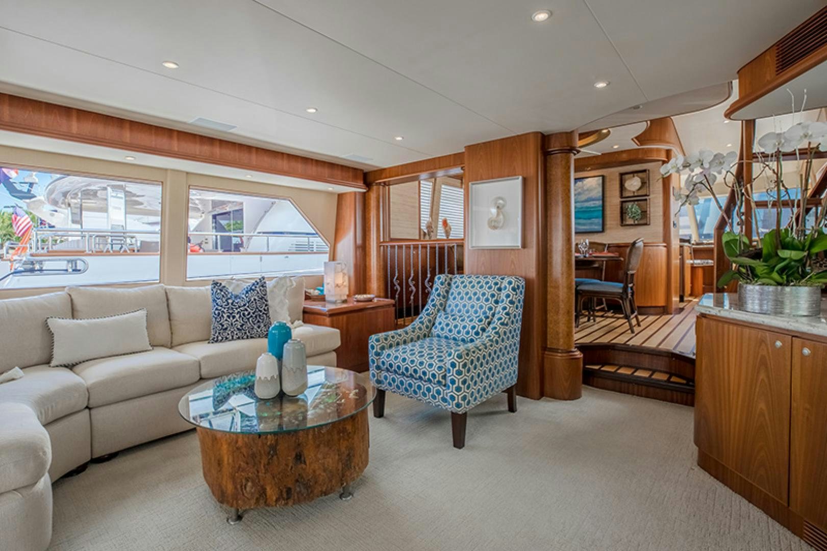 a living room with a couch and a table aboard FAN TAIL Yacht for Sale