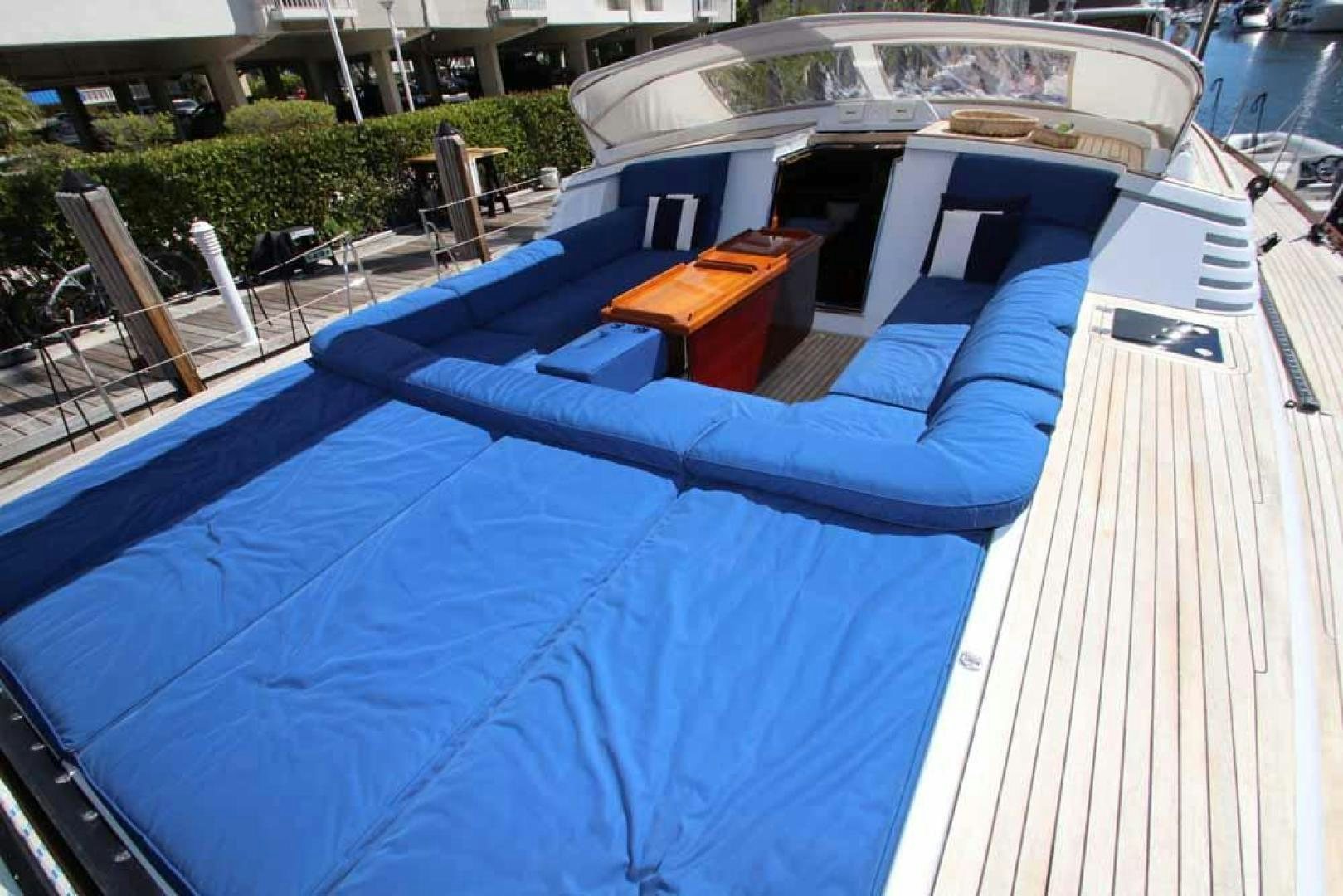 a pool with a deck and chairs aboard MAYA RAY Yacht for Sale