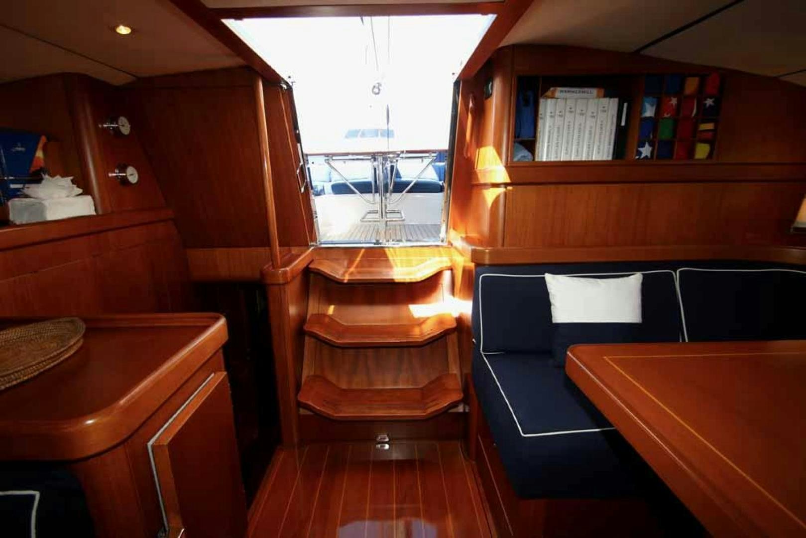 a room with a desk and a bed aboard MAYA RAY Yacht for Sale