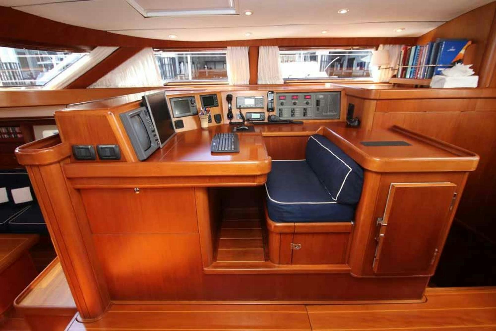 a room with computers and books aboard MAYA RAY Yacht for Sale