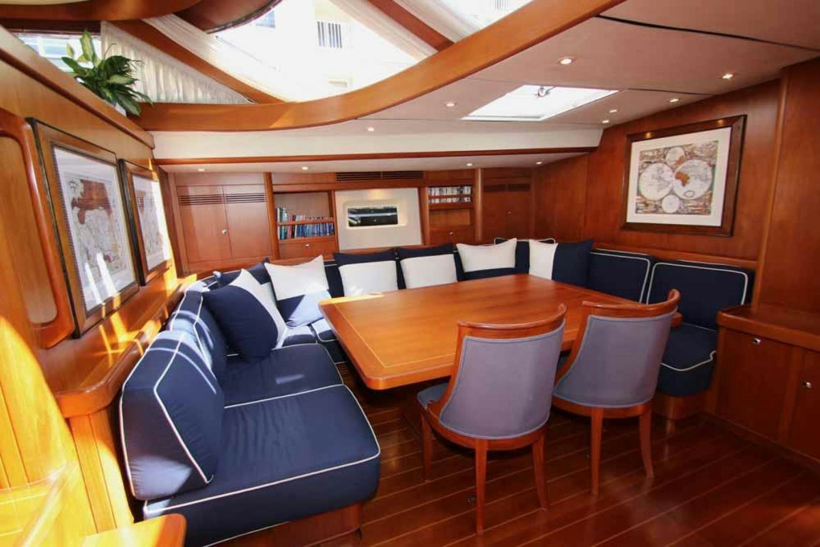 a room with a couch and a table aboard MAYA RAY Yacht for Sale