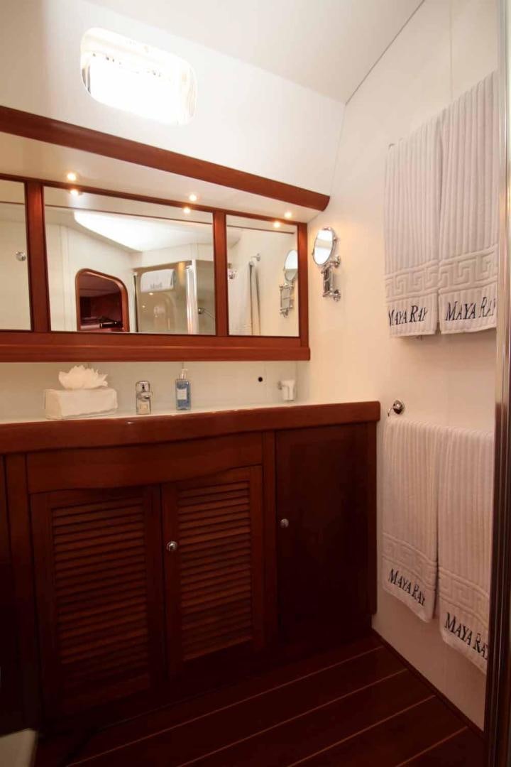 a bathroom with a mirror aboard MAYA RAY Yacht for Sale