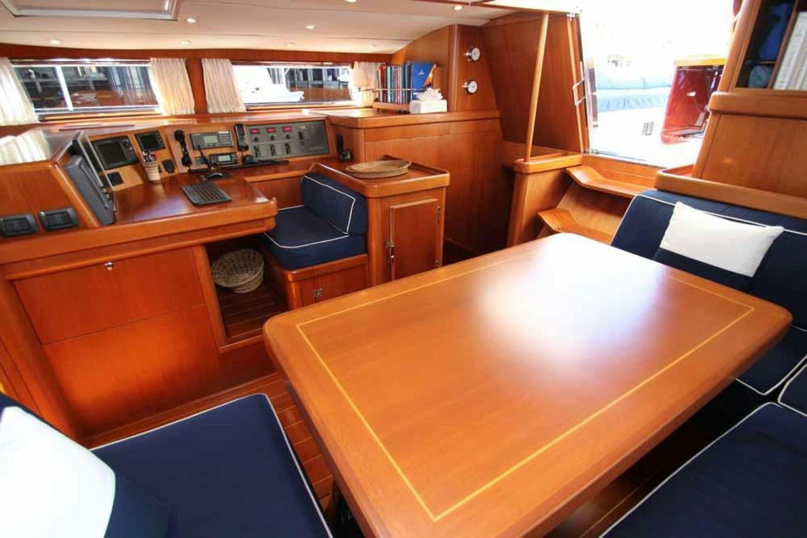 a room with a desk and chairs aboard MAYA RAY Yacht for Sale