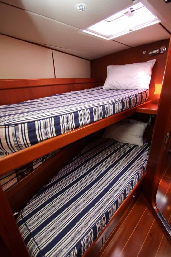a room with bunk beds aboard MAYA RAY Yacht for Sale