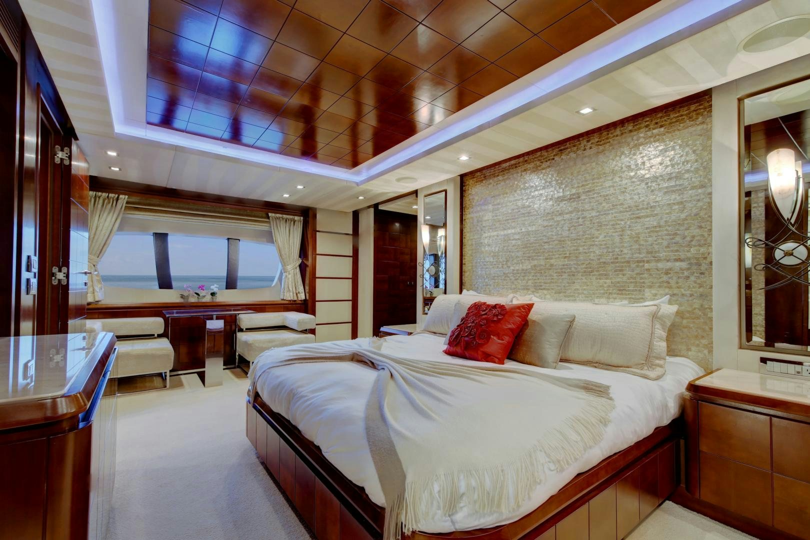 a large room with a bed and a window aboard SORRIDENTE Yacht for Sale