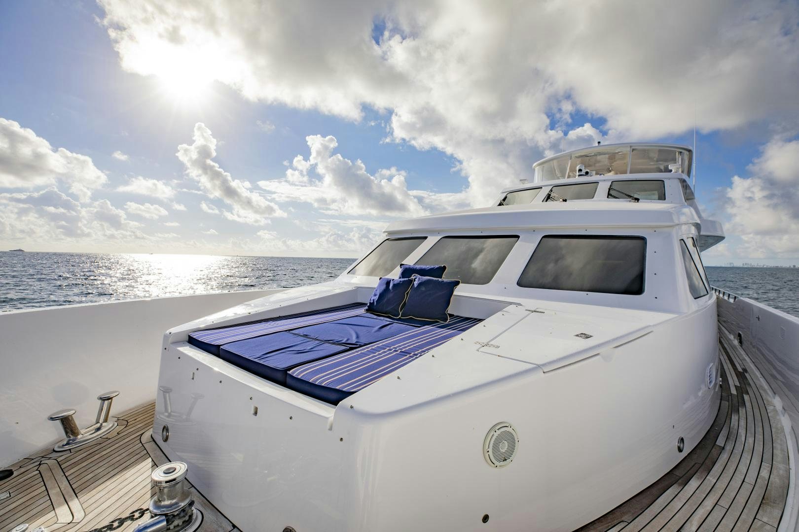 a white yacht on a dock aboard FLY BOYS Yacht for Sale