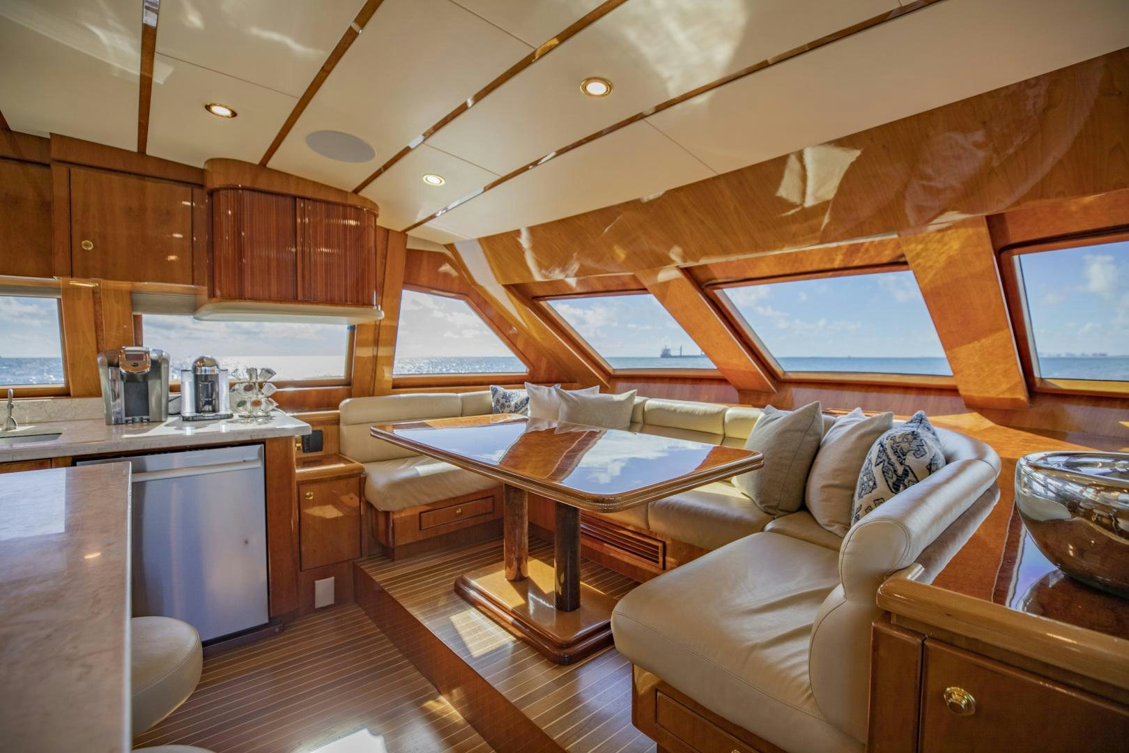 a living room with wood cabinets aboard FLY BOYS Yacht for Sale