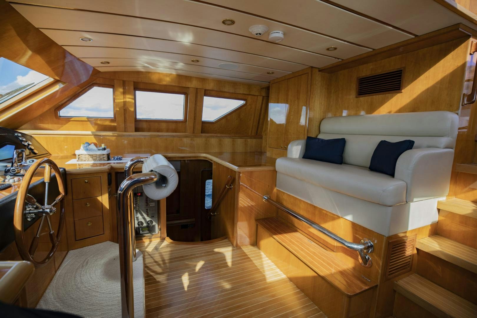 a room with a couch and a table aboard FLY BOYS Yacht for Sale