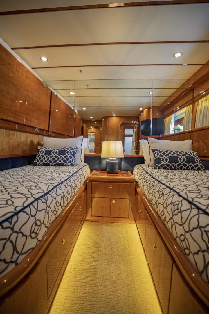 a bedroom with two beds aboard FLY BOYS Yacht for Sale
