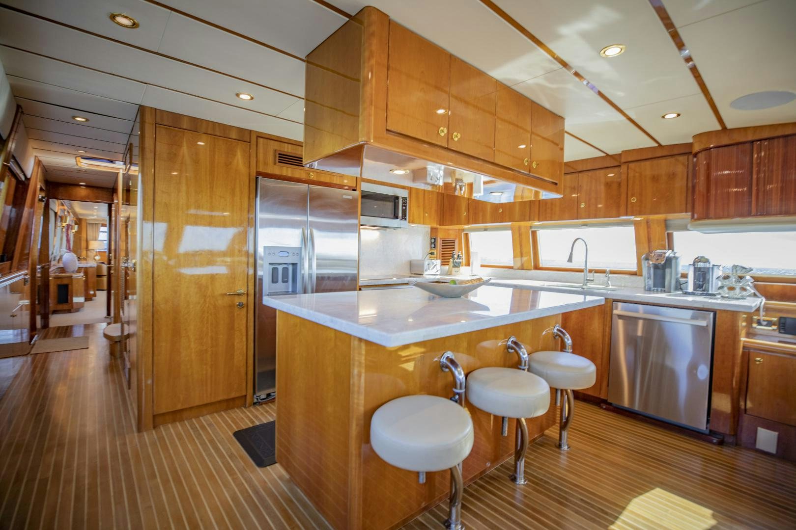 a kitchen with wooden cabinets aboard FLY BOYS Yacht for Sale
