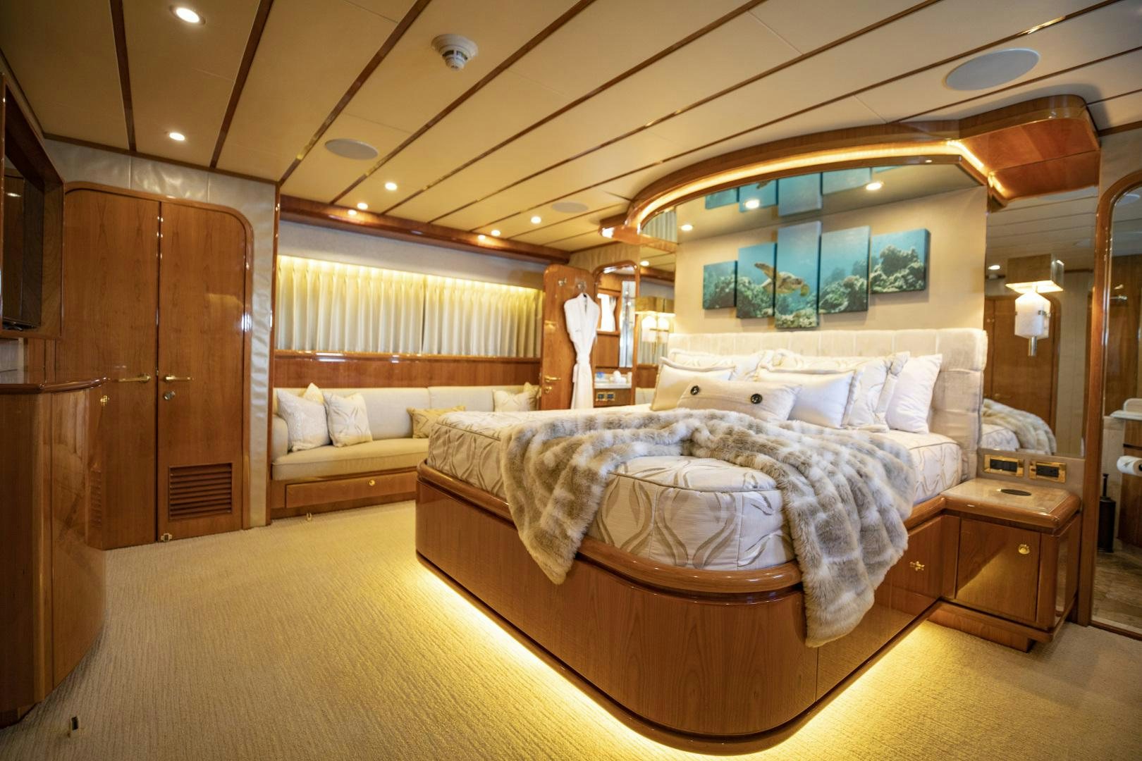 a room with a bed and a mirror aboard FLY BOYS Yacht for Sale