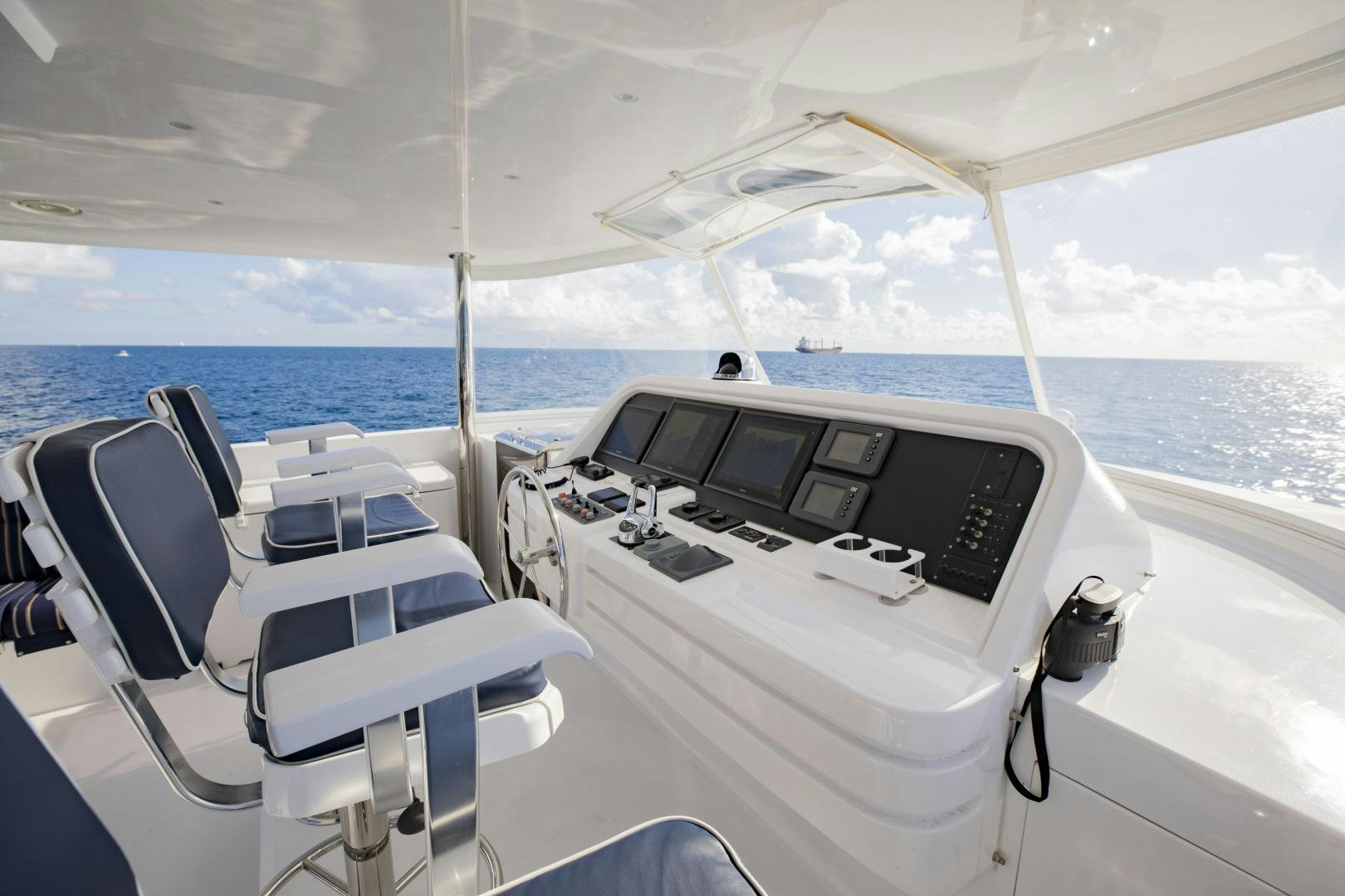 a boat with a view of the ocean and the land below aboard FLY BOYS Yacht for Sale