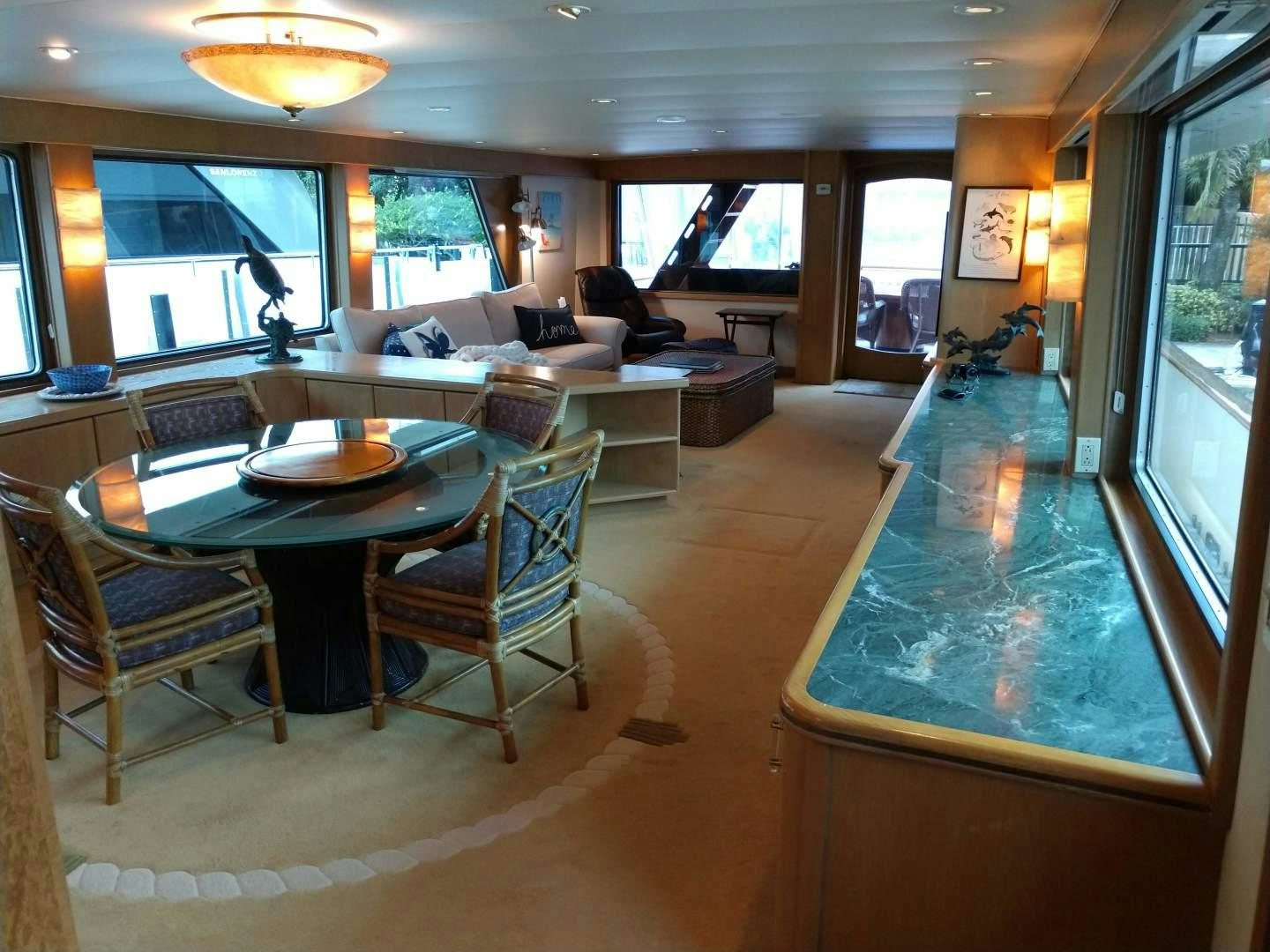 a person sitting on a couch in a living room aboard CAROLE TOO Yacht for Sale