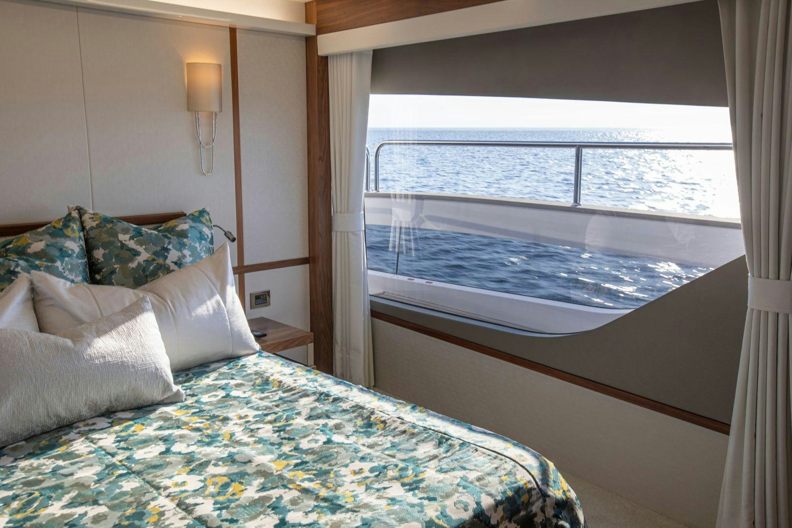 a bed with a window aboard PERSEVERANCE 3 Yacht for Sale