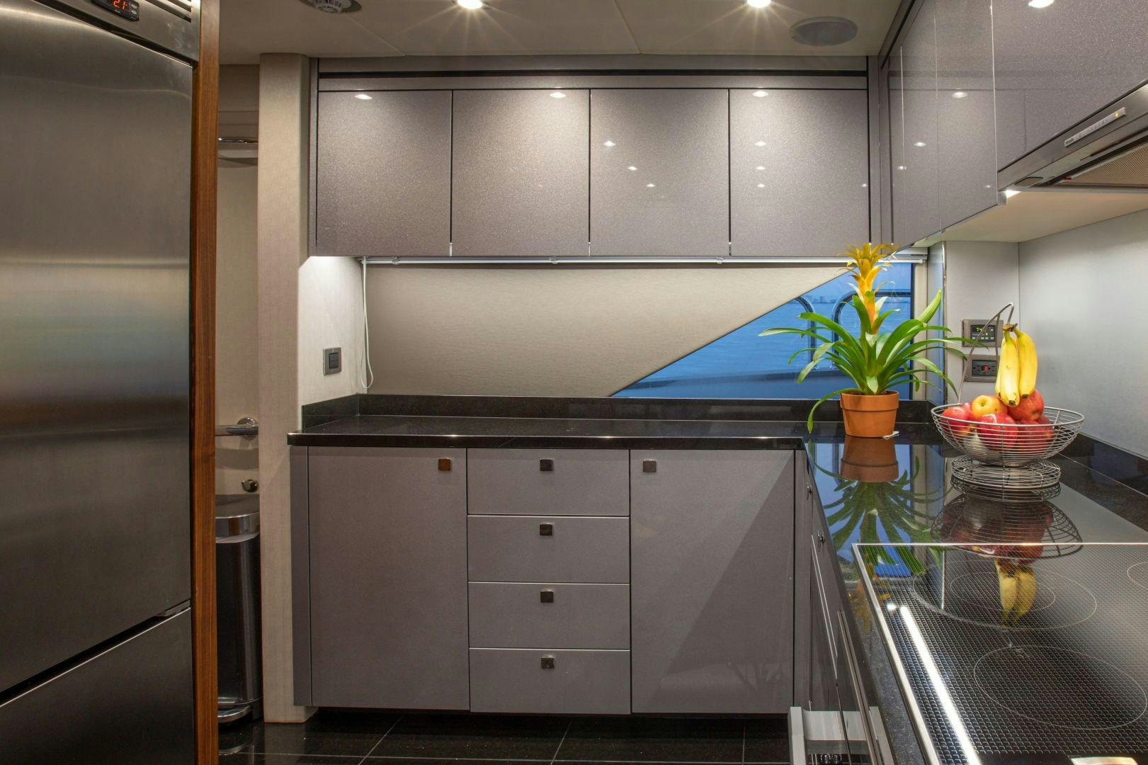 a kitchen with a glass counter top aboard PERSEVERANCE 3 Yacht for Sale