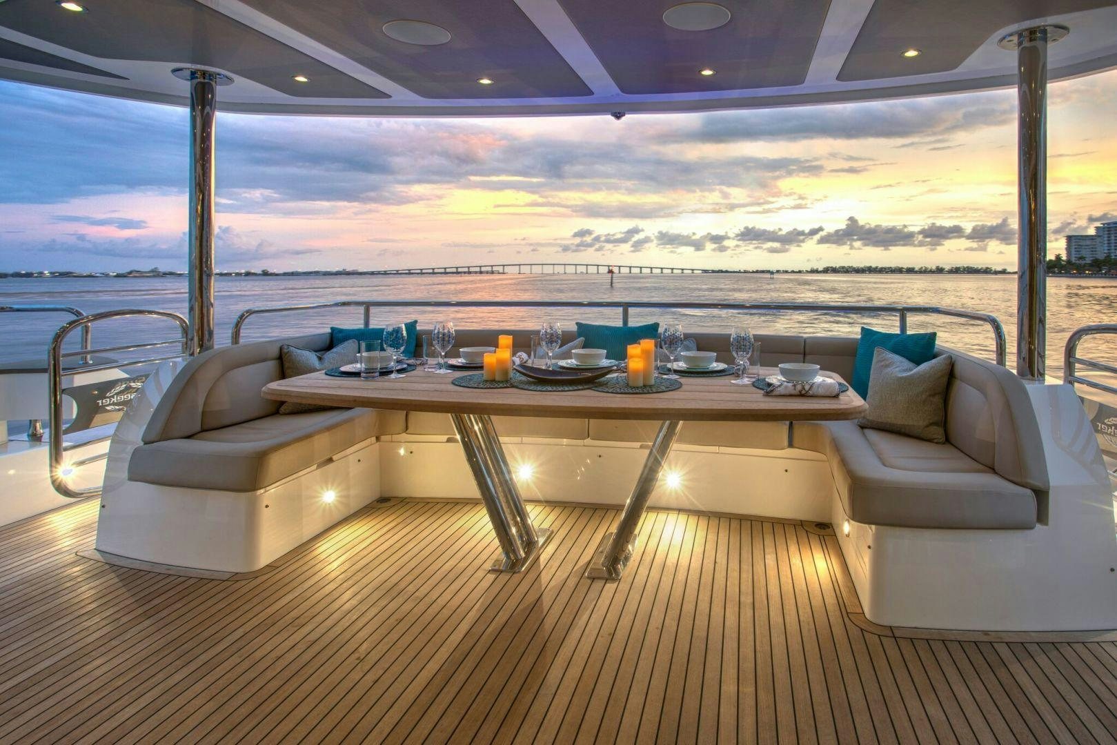 a table with chairs and a couch aboard PERSEVERANCE 3 Yacht for Sale