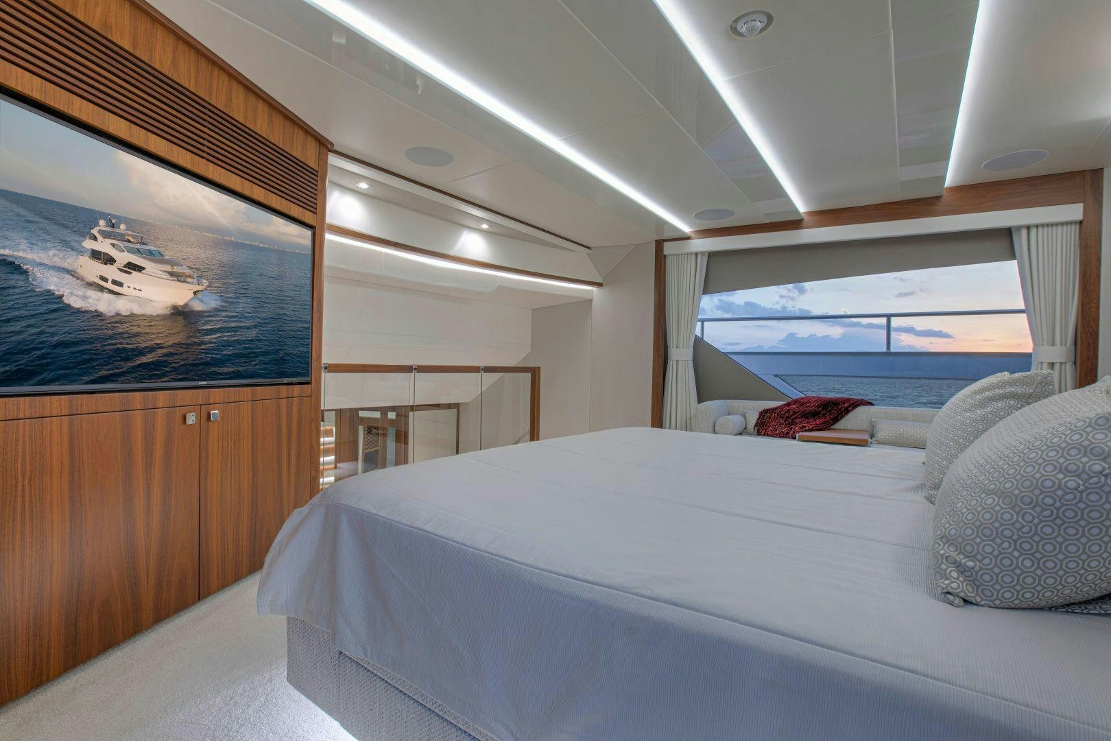 a bedroom with a bed and a window aboard PERSEVERANCE 3 Yacht for Sale