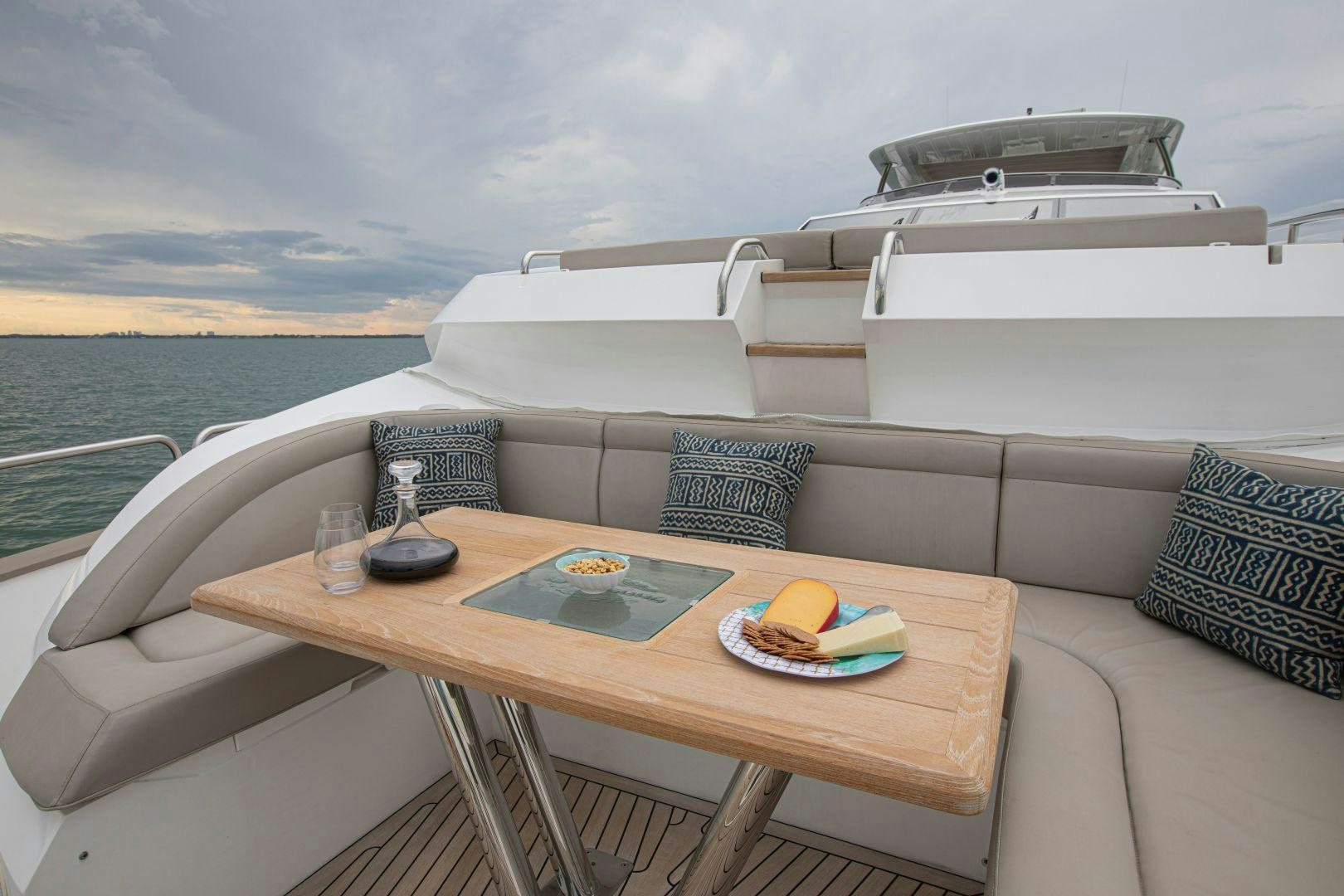 a couch with a table on it aboard PERSEVERANCE 3 Yacht for Sale