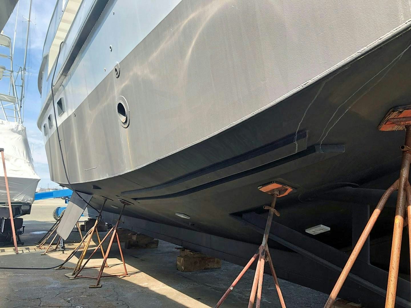 a large white boat with a large metal frame aboard CARE BEAR Yacht for Sale