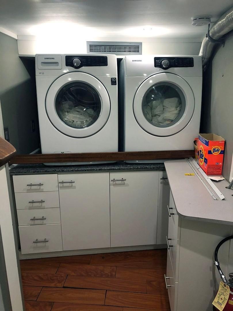 a washer and dryer in a room aboard CARE BEAR Yacht for Sale