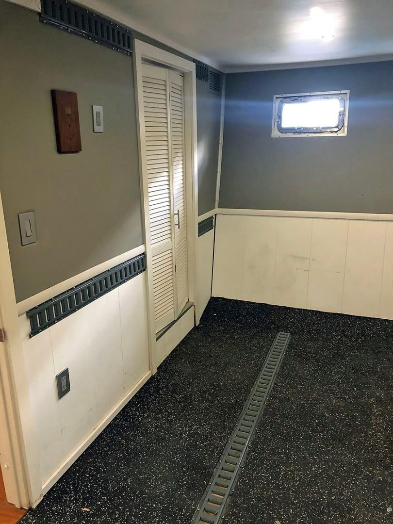 a hallway with a door and a window aboard CARE BEAR Yacht for Sale