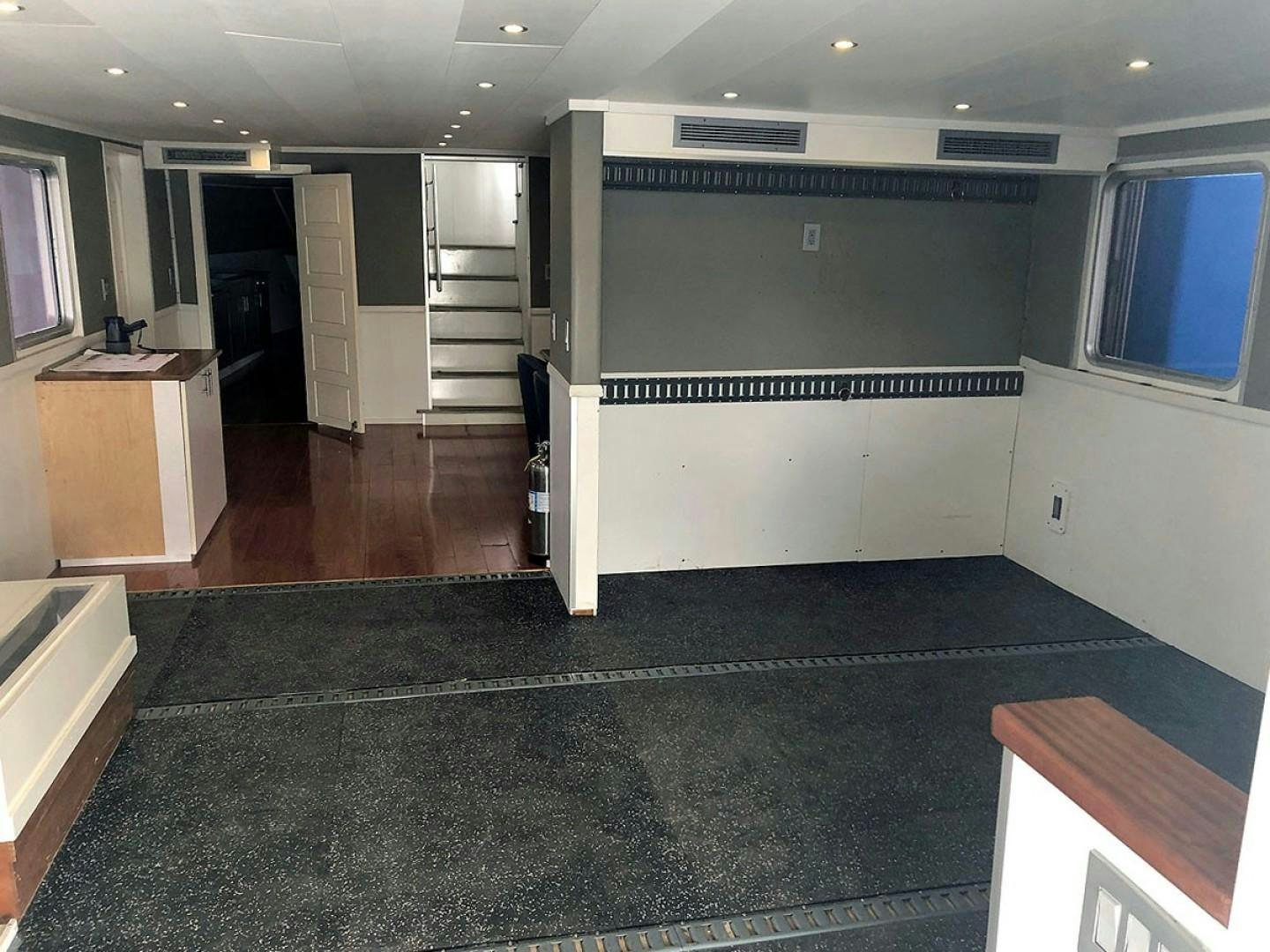 a room with a black floor aboard CARE BEAR Yacht for Sale