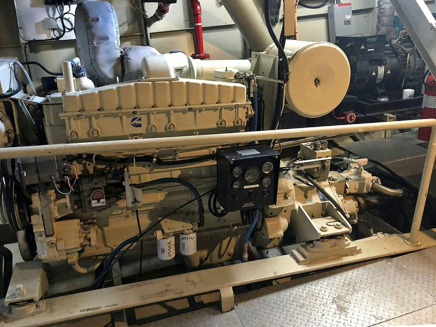 a machine with a large piece of wood on the side aboard CARE BEAR Yacht for Sale